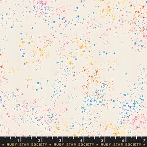 May include: Off-white fabric with a colorful splatter pattern. The design features small, irregular dots in shades of blue, pink, yellow, and orange scattered across the surface. The text "RUBY STAR SOCIETY" is printed at the bottom.