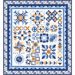 May include: A quilt with a patchwork design featuring a variety of blue, white, and orange squares and geometric shapes. The quilt is surrounded by a blue and white border.