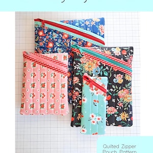May include: Four quilted zipper pouches in floral and fruit patterns, with diagonal zippers and contrasting trim. The pouches are in different sizes. Text on the image reads "Hemingway Pouch" and "Quilted Zipper Pouch Pattern in Four Sizes."