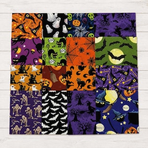 May include: A square fabric patchwork quilt featuring sixteen distinct Halloween-themed patterns. Designs include black cats, ghosts, bats, pumpkins, witches' hats, mummies, spiders, webs, and trees in a vibrant color palette of orange, purple, green, and black.