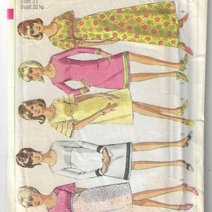 May include: Vintage Simplicity sewing pattern number 6457 for a junior size 11 dress with a 80 cm bust. The pattern includes five different dress styles with various necklines, sleeve lengths, and skirt lengths. The pattern is printed on a white background with illustrations of the dresses being worn by five different models.