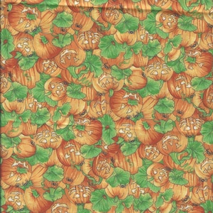 Diseño de calabaza tallada por Joann, naranja y verde - 1 yarda de tela de algodón