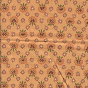 May include: A patterned fabric featuring a repeating design of stylized flowers and starbursts. The flowers are peach-coloured with green leaves, and the starbursts are purple and white, on a tan background.