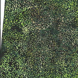 May include: Green fabric with a repeating pattern of leaves and dots. The fabric has a batik style design.