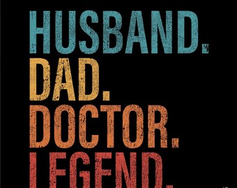 May include: A vintage-style graphic with the text "Husband. Dad. Doctor. Legend." in a distressed font with a colour gradient from blue to orange.