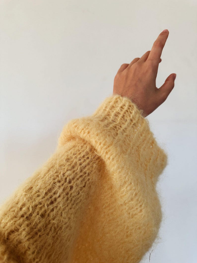 A stylish vanilla color cardigan, emphasizing comfort and elegance.