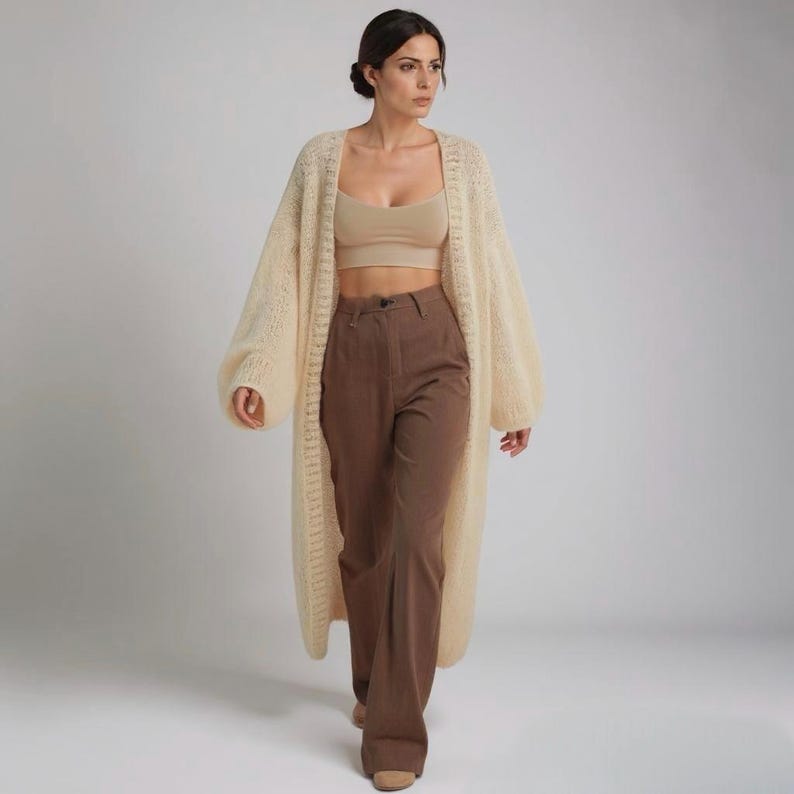 An elegant beige cardigan, showcasing its knitted texture.