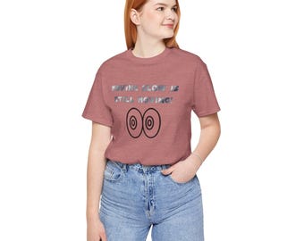 May include: A heather red t-shirt with the text "Moving slow is still moving!" and two black circles below the text.