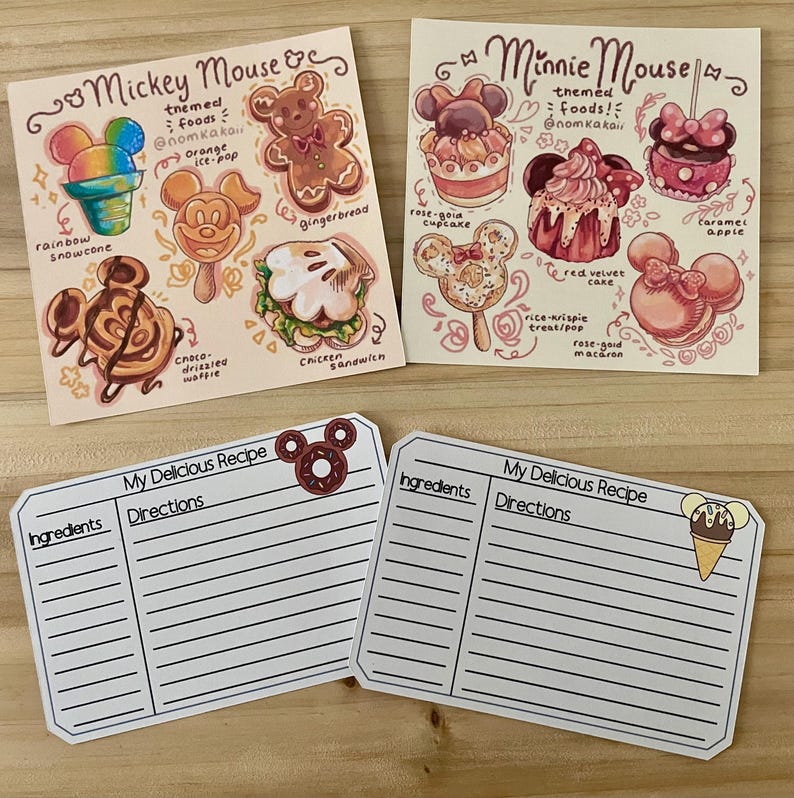 May include: Four illustrated cards featuring Mickey and Minnie Mouse-themed foods, including a rainbow snowcone, gingerbread, and a red velvet cake. Two recipe cards are also shown, with space for ingredients and directions.