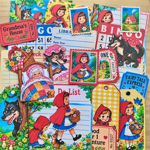 May include: A collection of paper ephemera featuring Little Red Riding Hood and wolf illustrations, including bingo cards, library cards, postage stamps, and gift tags with colorful floral, forest, and cottage motifs in a vintage storybook style.