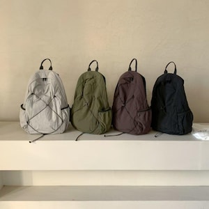 Mochila ligera de nailon, mochila de viaje arrugada, mochila escolar informal, mochila gris, caqui, marrón y negra.