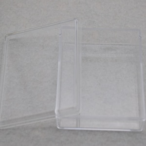 May include: A clear plastic storage box with a hinged lid. The box is empty and ready to be filled with items.