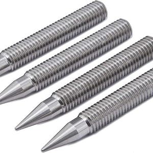 May include: Four silver metal tapered points with a threaded design.
