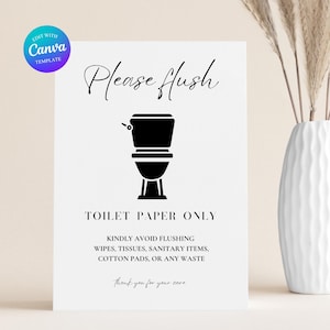 May include: A white sign with black text and a toilet graphic. The sign reads "Please flush" and "TOILET PAPER ONLY." It also includes a list of items to avoid flushing. A vase with decorative stems is in the background.