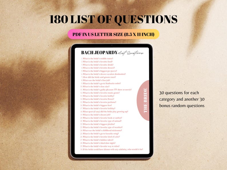 May include: A digital screen displaying a list of 180 questions for a hen party game called "Bach Jeopardy". The questions are in a list format and cover various topics about the bride. The screen is on a light brown surface. The text "THE BRIDE" is in a pink circle on the right side of the screen.