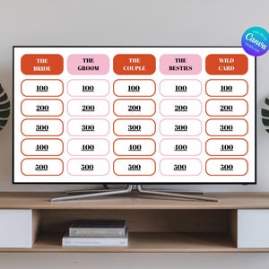 May include: A white board with a red and pink grid of squares. Each square has a number printed in black. The squares are labelled with the words "The Bride", "The Groom", "The Couple", "The Besties", and "Wild Card".