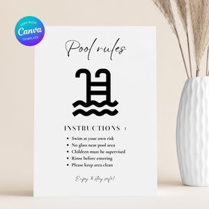 May include: A white sign with black text and a pool graphic. The sign reads "Pool rules" and includes instructions: Swim at your own risk, no glass near pool area, children must be supervised, rinse before entering, and please keep area clean.
