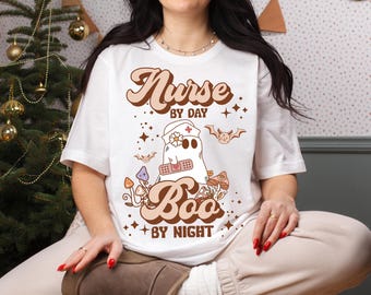 Halloween Nurse T-Shirt, Spooky Nurse Tee, Boo by Night Shirt, Unisex Halloween Apparel, Funny Nurse Gift