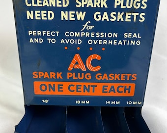 Espositore in metallo per guarnizioni di candele AC vintage, ideale per garage e officina auto.