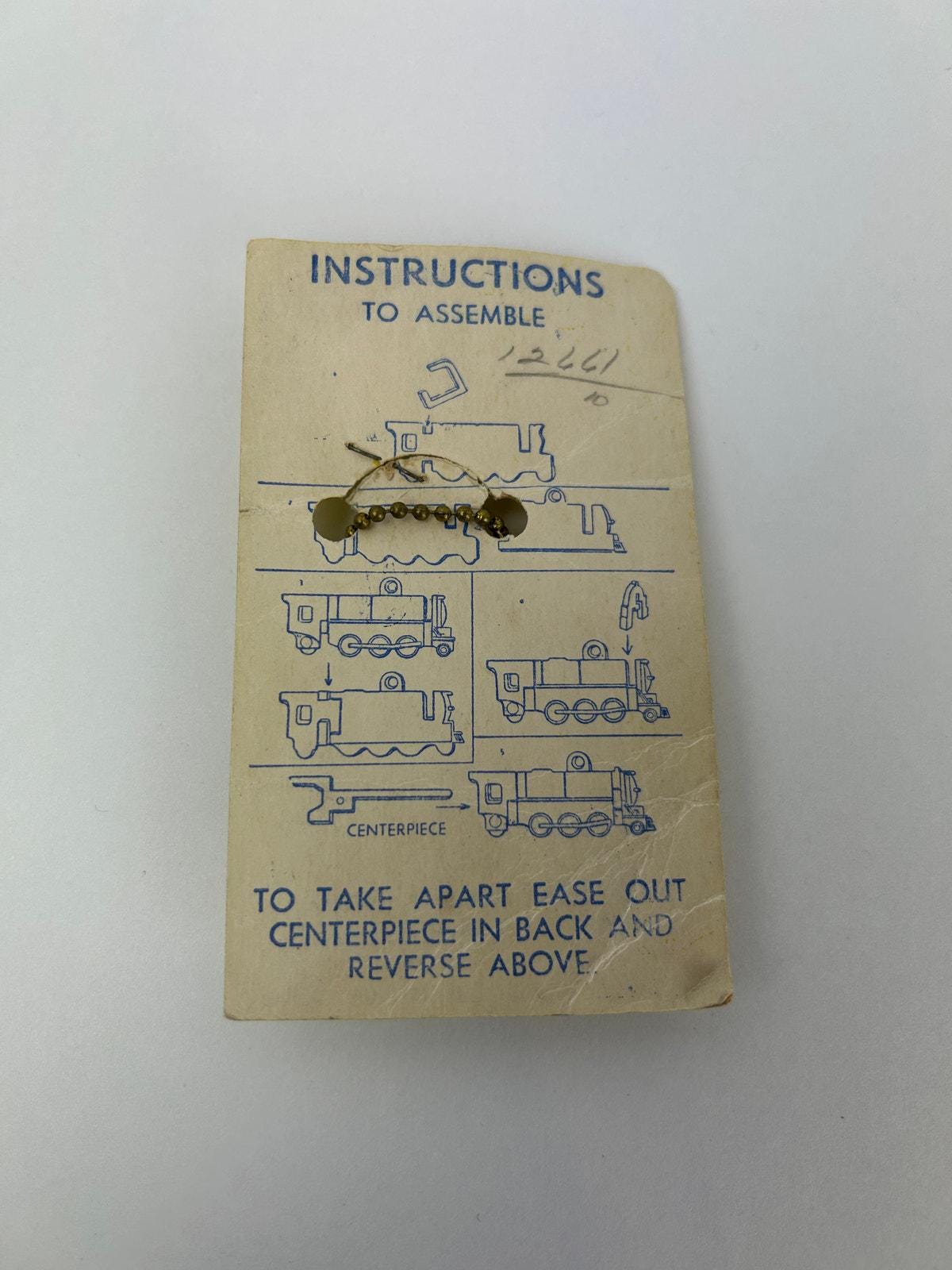 Vintage Loco-motive Key Chain Puzzle Train 1950s Plastic Toy on  display picture 1