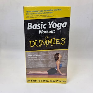 May include: A black and yellow box titled "Basic Yoga Workout for Dummies." The box features a woman in a yoga pose and text that reads "Sara Ivanhoe, Yoga Professional, Practicing Yoga for Over 10 Years." The box also includes the text "An Easy-To-Follow Yoga Practice."