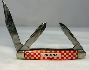 Couteau de poche publicitaire Purina vintage USA, manche multi-lames en damier rouge
