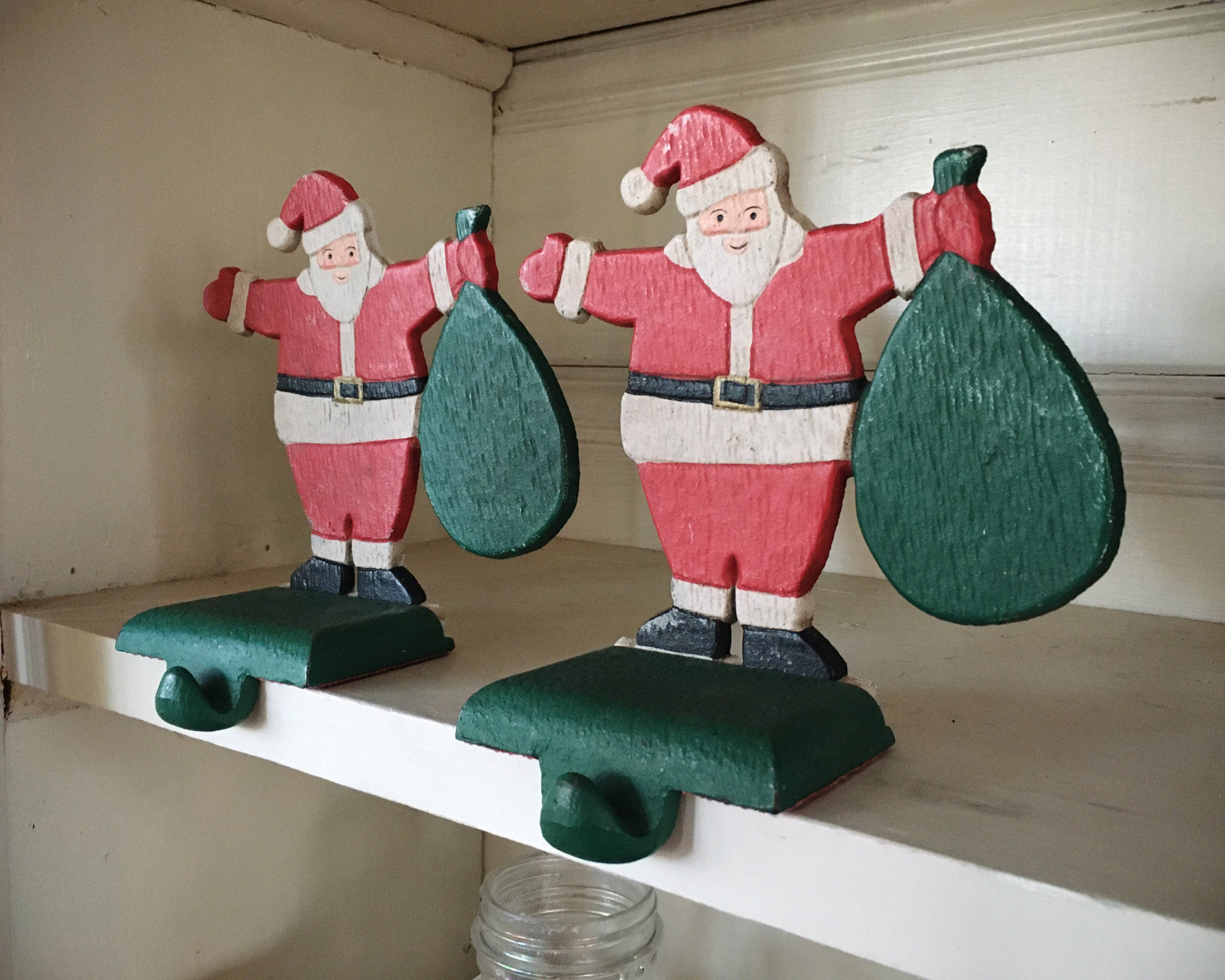 Two Large Cast Iron Santa Claus Christmas Stocking Holders