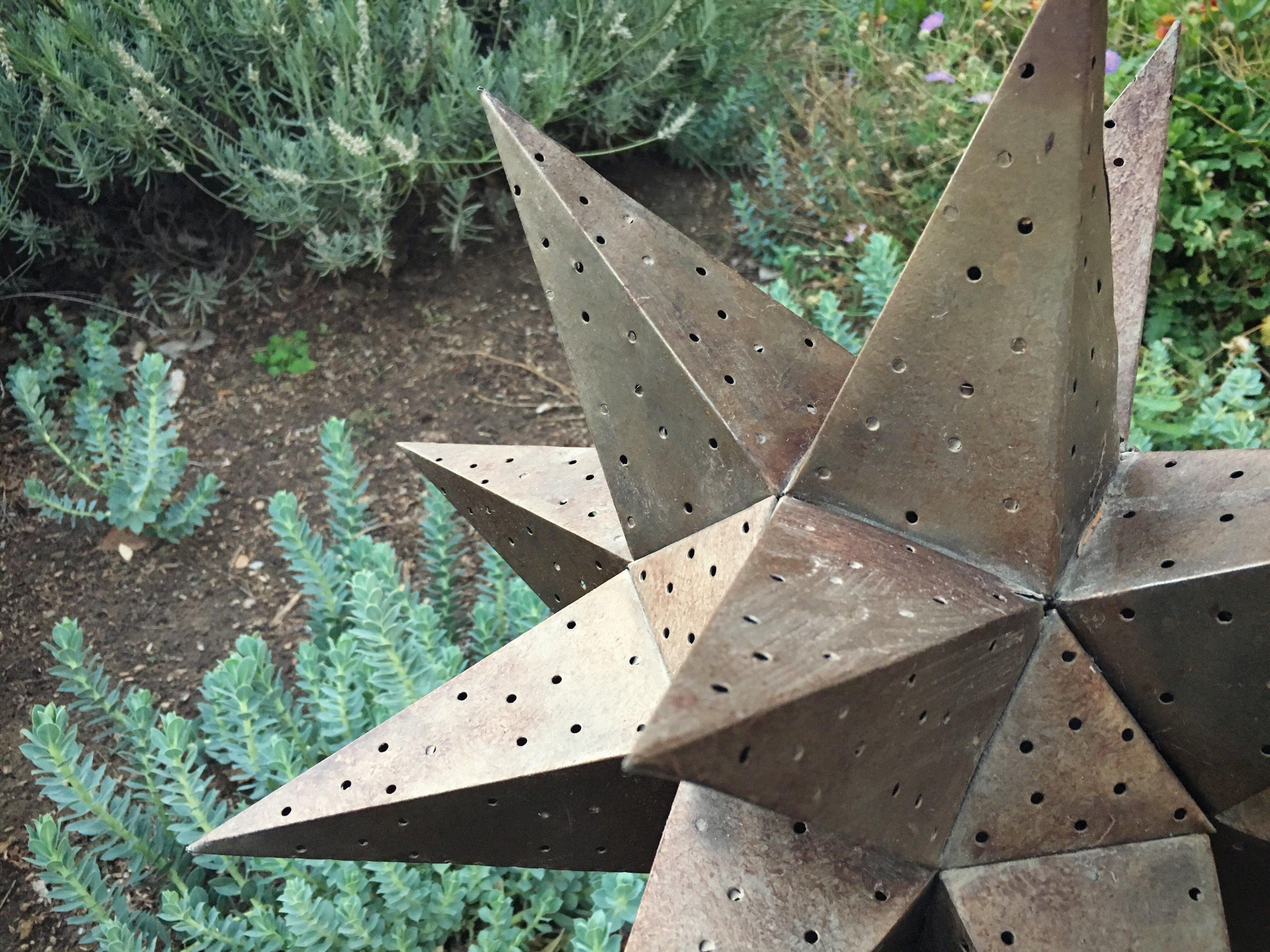 Large vintage punched metal star candle holder Moravian star