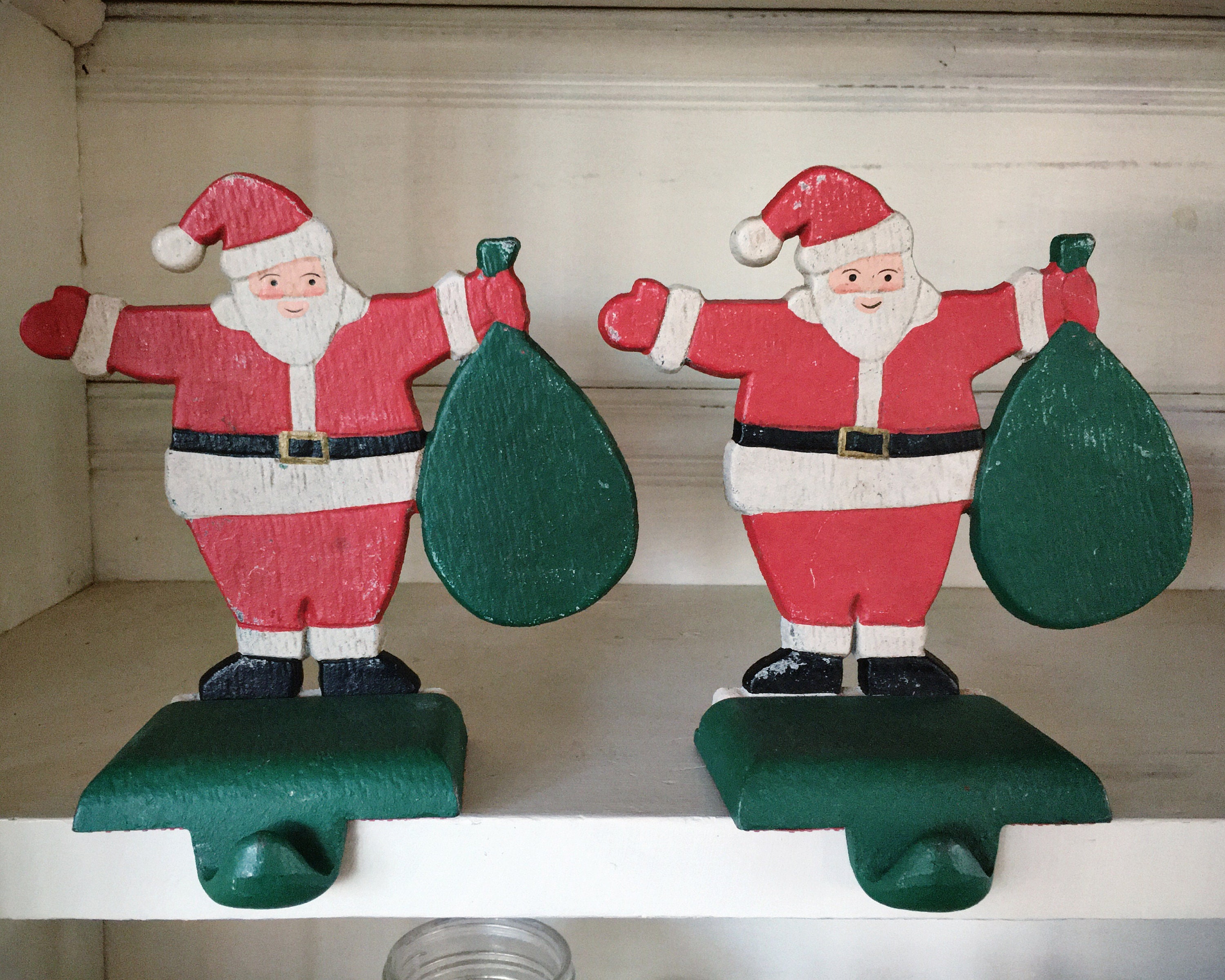 Two Large Cast Iron Santa Claus Christmas Stocking Holders for Mantle
