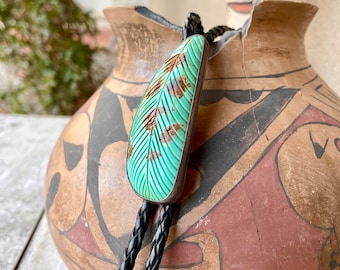 Vintage Carved Number 8 Turquoise Feather Bolo Tie by Clarence Bailon of Santo Domingo Pueblo