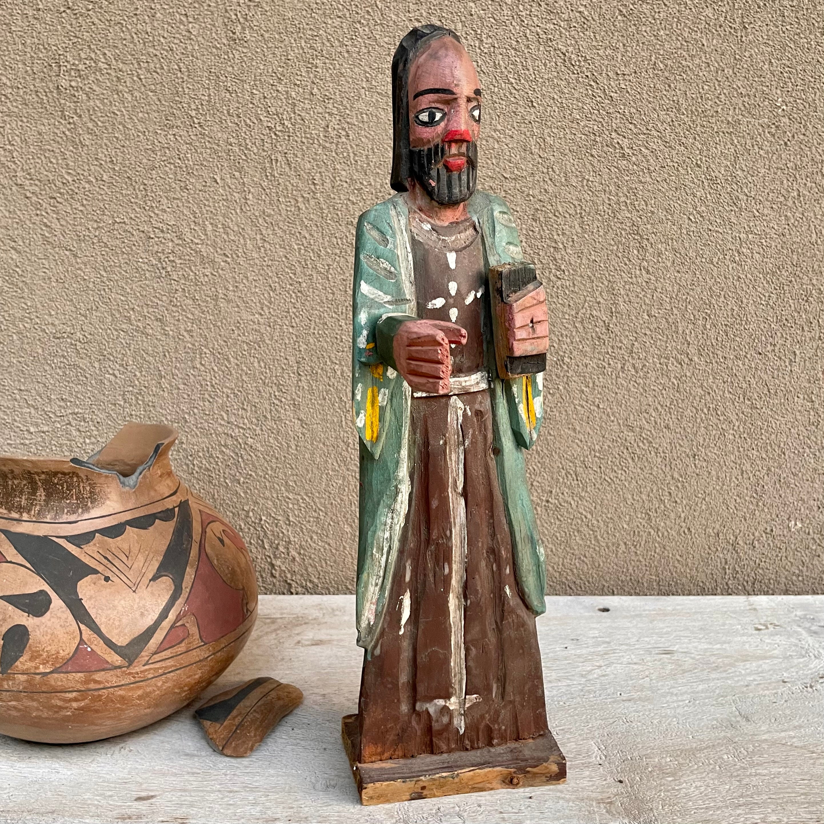 Carved Wooden Hands Holding Bible