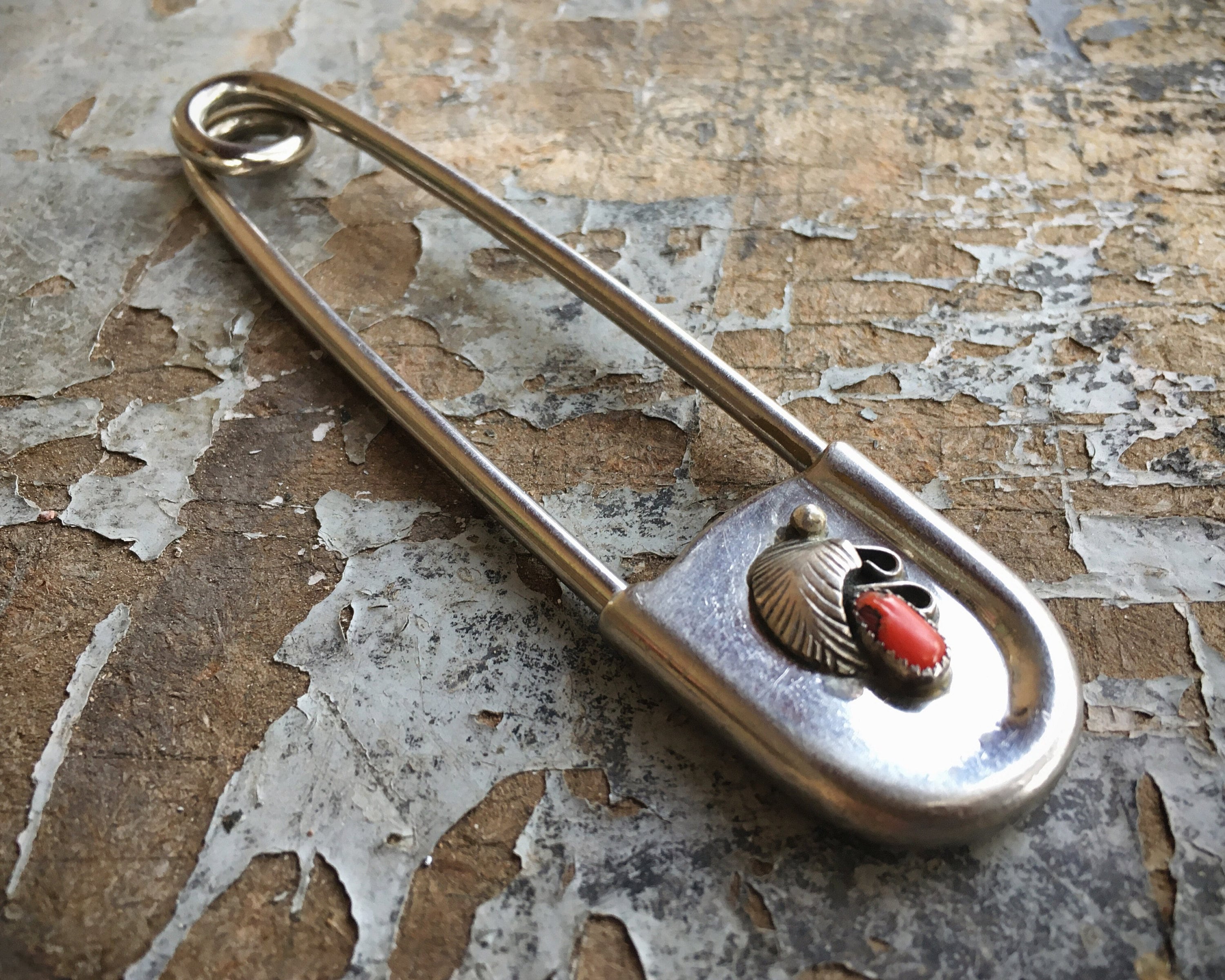 large silver brooches and pins