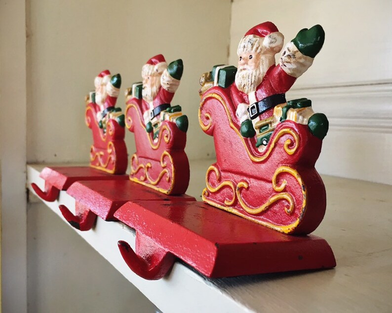 Three Small Cast Iron Santa Claus Christmas Stocking Holders For Mantle Vintage Christmas Decor Free Standing Stocking Hanger