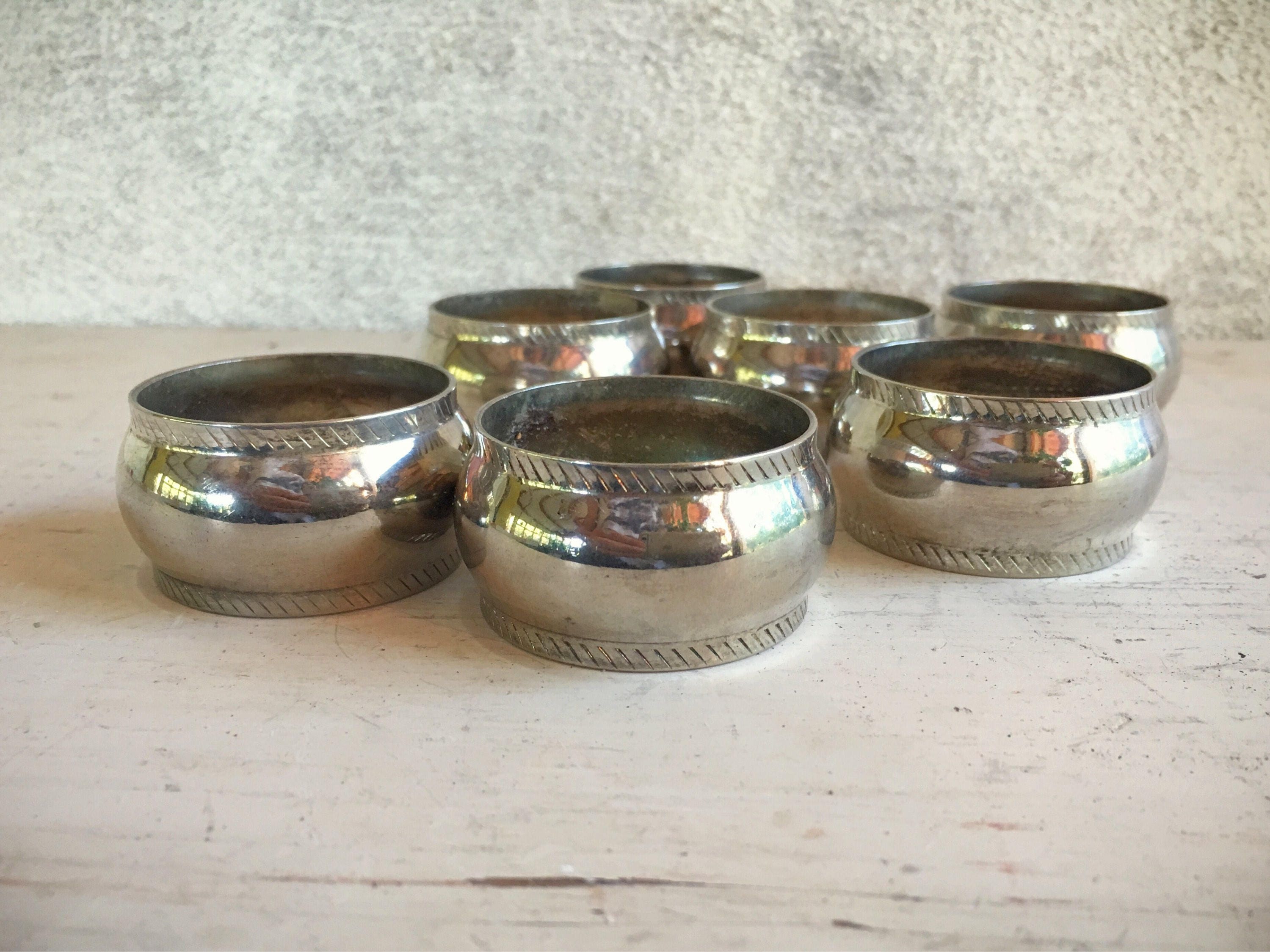Set of seven silver plated round napkin rings holiday table setting
