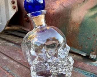 Clear Skull Shaped Bottle with Added Blue Glass Stopper, Halloween Party Decanter Decor