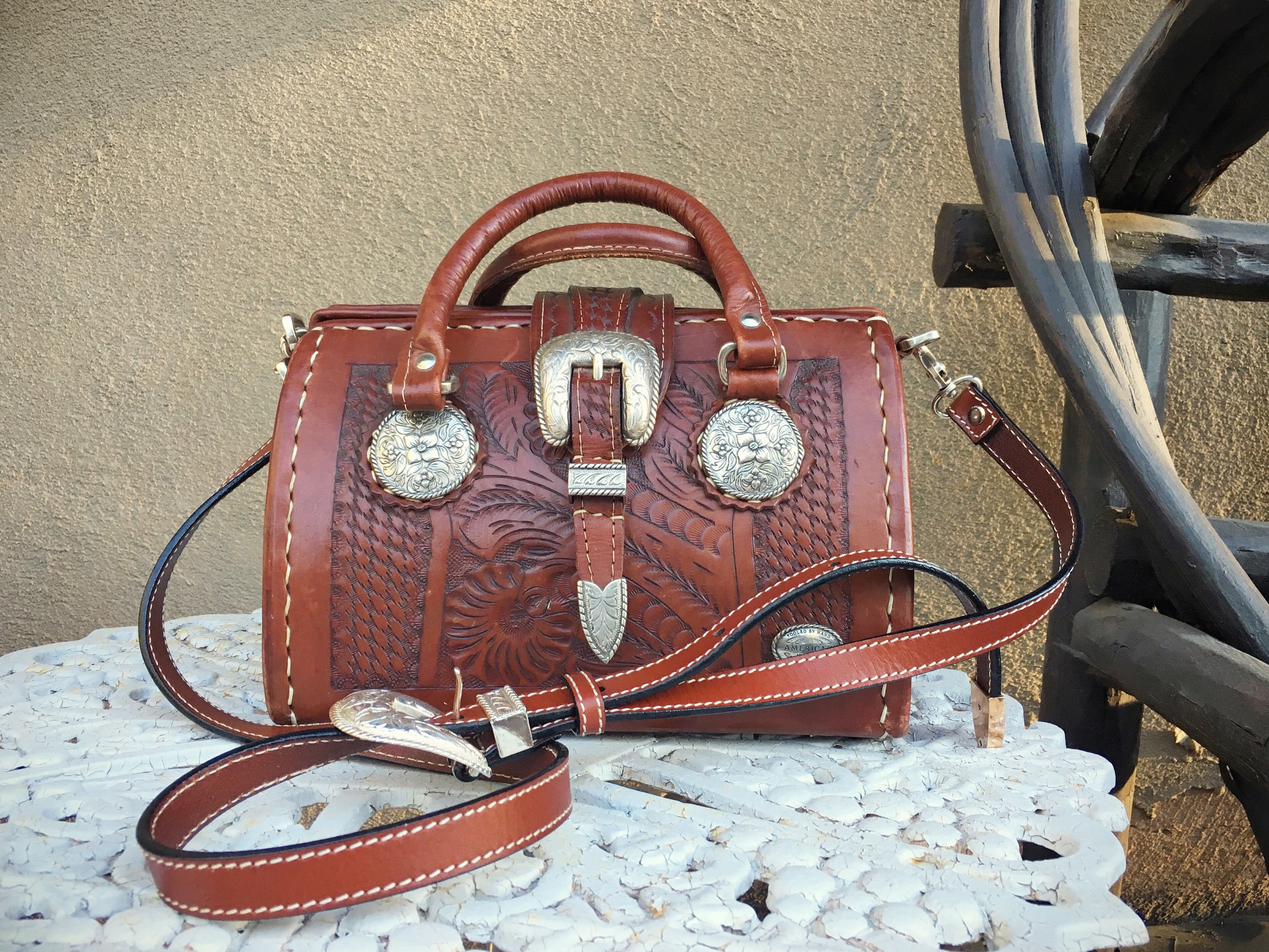 Handmade weekender bag by WesternSkiesHandmade. Hand-carved top with  acid-washed cowhide body an… | Hand tooled leather, Leather bags handmade,  Western bags purses