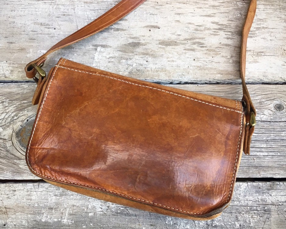 De Martino distressed leather crossbody bag with asymmetrical flap