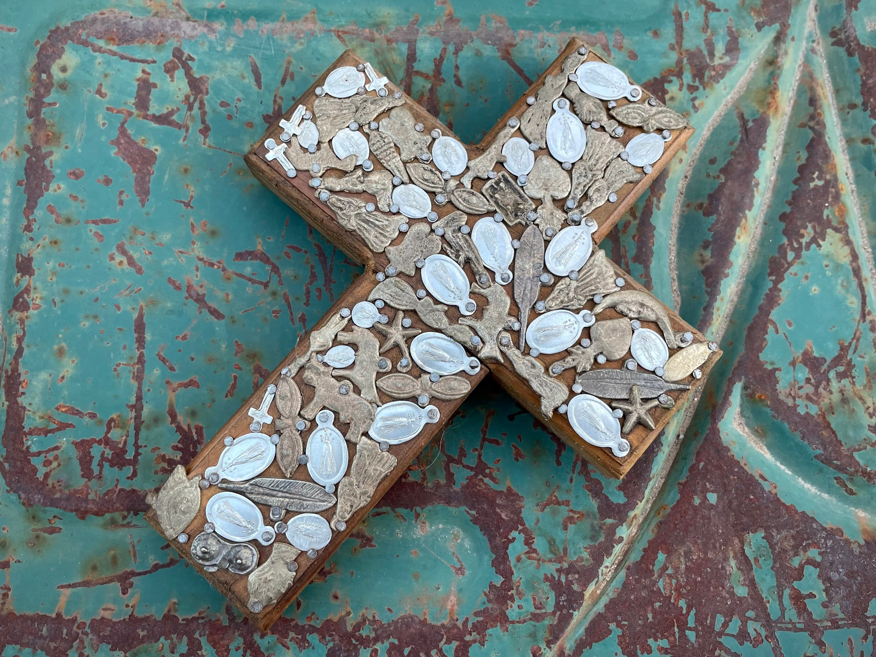 WOOD CROSS ANGEL FORM WITH TIN MILAGROS AND BEADED MEDALLIONS 11 X 9