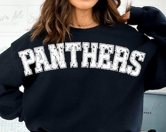 May include: Black sweatshirt with the word "PANTHERS" in distressed white block letters across the chest. The sweatshirt is a crew neck style. The image is a close-up of the sweatshirt.