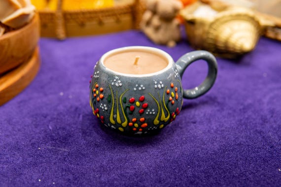 coffee candle in a ceramic cup