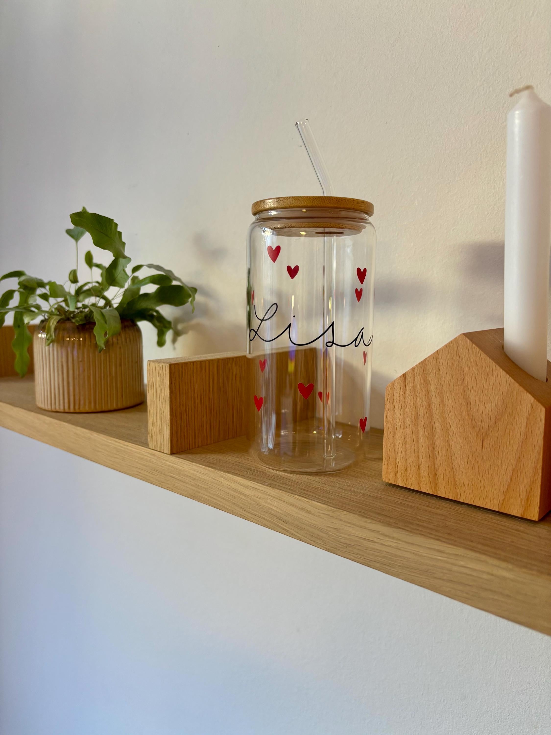 Glas mit deckel und strohhalm buch