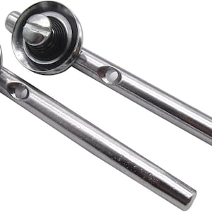 May include: Two silver metal cabinet door hinges with a round knob on each end. The knobs have a spring mechanism and a screw in the center.