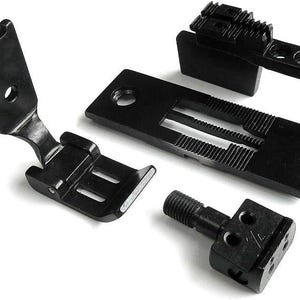 May include: Four black sewing machine parts, including a foot, a needle plate, a presser foot, and a feed dog.