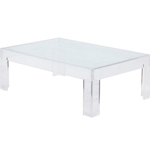 May include: A clear acrylic coffee table with a rectangular top and four legs. The table is made of a transparent material and has a modern design.