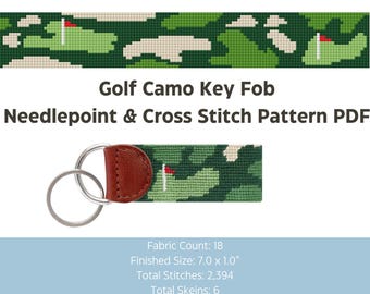 May include: A key fob with a golf course camouflage pattern. The key fob is green, beige, and white with a red flag. The key fob has a brown leather backing and silver key rings. The text "Golf Camo Key Fob Needlepoint & Cross Stitch Pattern PDF" is displayed.