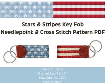 May include: Two key fobs with a patriotic theme. One features a blue background with white stars, the other has red and white stripes. Both have brown leather accents and metal key rings. The text reads "Stars & Stripes Key Fob Needlepoint & Cross Stitch Pattern PDF".