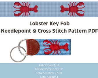 May include: A light blue needlepoint key fob featuring a red lobster design. The key fob has a brown leather backing and silver key rings. The text "Lobster Key Fob" and "Needlepoint & Cross Stitch Pattern PDF" are visible.