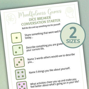 May include: A white paper with the text "Mindfulness Games DICE BREAKER CONVERSATION STARTER". The paper includes prompts for self-reflection, with a green circle that says "2 SIZES".