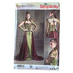 May include: A Simplicity 90th anniversary sewing pattern envelope D0792 H5, featuring a costume design with a green corset-style bodice, a long maroon skirt, and gold-toned shoulder armor. The packaging displays front and back views of the outfit.