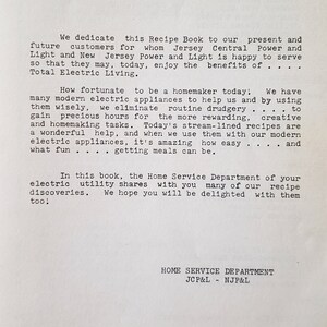 May include: A vintage printed page from a recipe book featuring black typewriter-style text on a white background. The text is a dedication from the Home Service Department of Jersey Central Power and Light and New Jersey Power and Light.